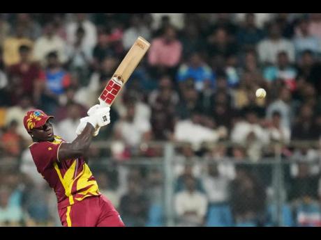 Credit: AP West Indies’ Rovman Powell plays a shot during the T20 World Cup cricket match between Zimbabwe and West Indies in Mumbai, India, on Monday.