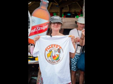 Credit: Contributed Debbie Allen celebrates her first visit from London, England, proudly shows off a Floyd’s Pelican Bar keepsake T-shirt at the recent reopening.