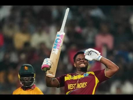 West Indies’ Shimron Hetmyer celebrates his half-century during the T20 World Cup cricket match between Zimbabwe and West Indies in Mumbai, India, on Monday.