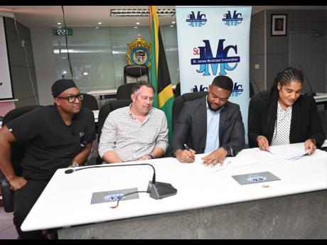 From left: Germaine Spencer, president of Montego Bay United, Yoni Epstein, head of Montego Multi-Sports Development Ltd, Richard Vernon, chairman of St James Municipal Corporation and Mayor of Montego Bay, and Corporation CEO Naudia Croskill at a ceremony yesterday to sign a 25-year lease agreement for the redevelopment of the Montego Bay Sports Complex. 