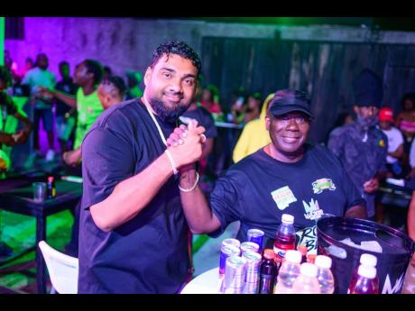 Credit: Contributed Romeich Major (left), the host of the evening, welcomes Dave Goldson, principal of Magnum Dancehall Week, to Romeich Games Night held on Wednesday, as part of the Dancehall Week celebrations.