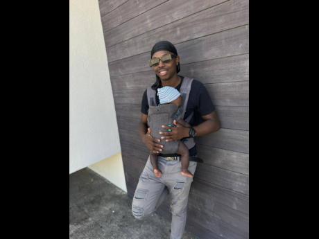 Credit: Contributed Singadon with his infant son.