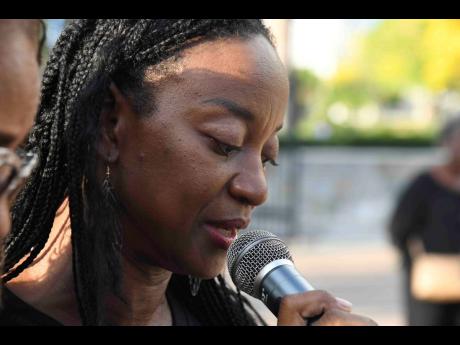 Tamara Morgan reads a tribute to her friend Melissa Silvera.