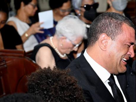 Jolyan Silvera sheds tears at the funeral service for his wife, Melissa Silvera.