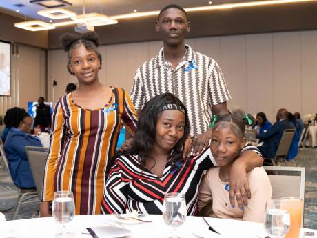 Family members of late trainee constable Desmond Thompson.