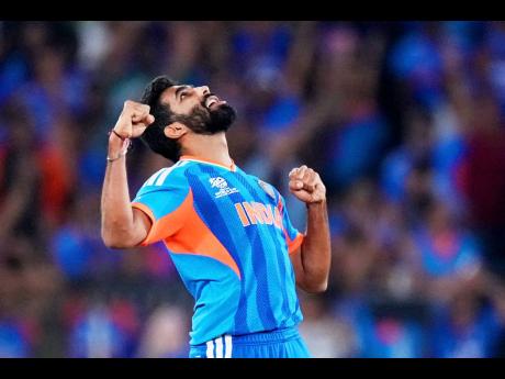 India’s Jasprit Bumrah celebrates the wicket of New Zealand’s Matt Henry during the T20 World Cup cricket final in Ahmedabad, India, on Sunday.