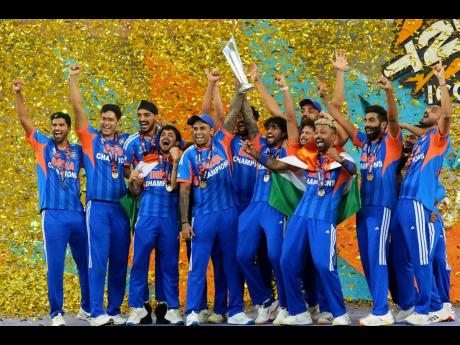 India’s players celebrate with the trophy after winning the T20 World Cup final cricket match against New Zealand, in Ahmedabad, India, on Sunday.
