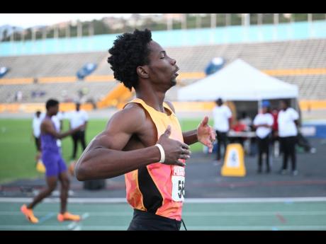 Elite Performance’s Zachary Wallace wins the Under-20 boys’ 400 metres at the Carifta Trials inside the National Stadium.