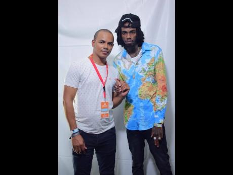 Group Managing Director of Dream Entertainment Scott Dunn (left) lymes with dancehall superstar Alkaline.