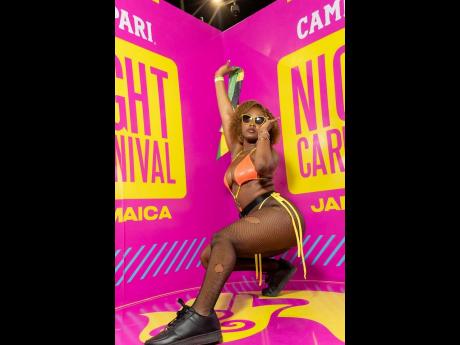 Shanakay Rhule came out to party in true Carnival fashion, ready to chip down the road with a Jamaica flag in hand.