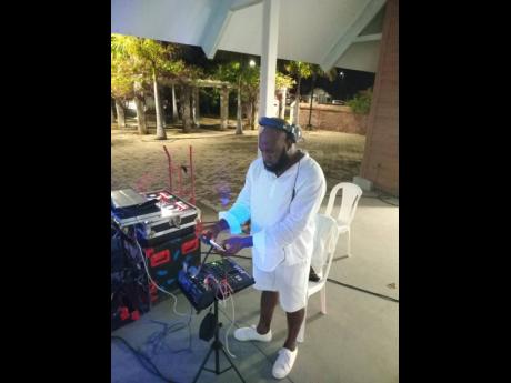 The ‘iPhone DJ’ Ricardo Williams playing some tunes with his phone hooked up to a mixing board.