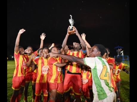 Cornwall College players celebrate winning the 2026 ISSA/Burger King rural Under-16 football title at St Elizabeth Technical High School on Thursday. Cornwall defeated Glenmuir High School 4-1.