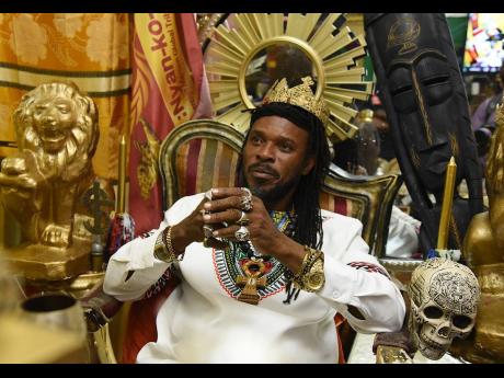 Credit: Ian Allen LA Lewis sits inside his office where he conducts spiritual advisory sessions for followers seeking direction.
