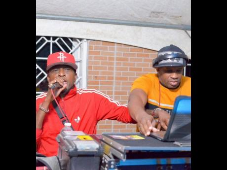 Credit: Contributed Di General Pink Panta (left) and DJ Skinny play at an event in Brown’s Town, St Ann.