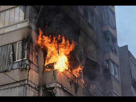 Credit: AP Smoke and flame rise from a residential building following an Israeli airstrike in central Beirut, Lebanon, last Wednesday.