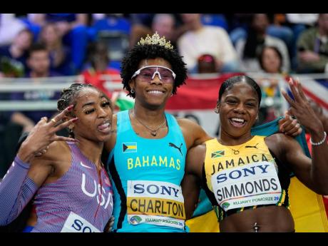 Devynne Charlton of Bahamas poses with Alia Armstrong (left) of the United States and Megan Simmonds of Jamaica, after winning the gold medal in the women’s 60 metres hurdles final at the World Athletics Indoor Championships in Torun, Poland, on Sunday.