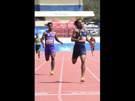Credit: Ian Allen Omary Robinson (right) from Jamaica College winning heat one of the boys’ Class One 400 metres in 46.93 seconds ahead of Jordan Rehedul of Kingston College, in 47.89 seconds, during the Corporate Area High School Track and Field Athletics Championships at the Ashenheim Stadium.