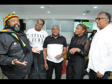From left: Solomon Sharpe, SVREL’s executive chairman; Chloleen Daley-Muschett, SVL AVP of Communications & PR; Ian Burnett, journalist at Quick Gallop JA; Arielle Beckles, SVREL brand optimisation manager; and Denzil Miller Jr., SVREL racing secretary, discussing the historic expansion of the Caribbean’s richest two-day racing programme inside the Directors’ Box at Caymanas Park on Saturday.