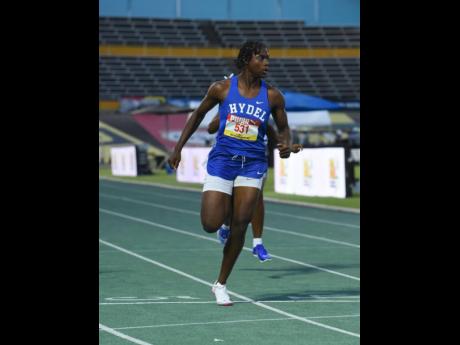 Credit: Ian Allen Shemonique Hazle of Hydel High wins her Class One 100 metres heat in a wind-aided 11.44 seconds.
