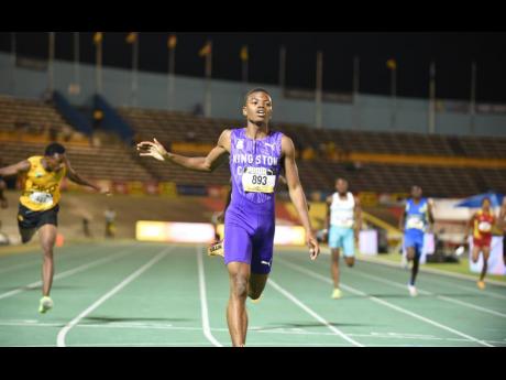 Jason Pitter of Kingston College smashes the boys’ Class Two 400m record on day three of the ISSA GraceKennedy Boys and Girls’ Athletics Championships at the National Stadium on Thursday night.