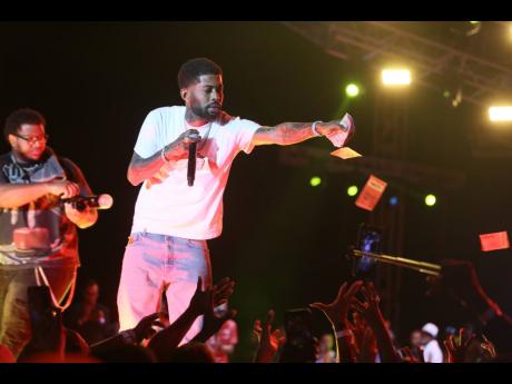 Skippa ‘making it rain’ with $5,000 notes.