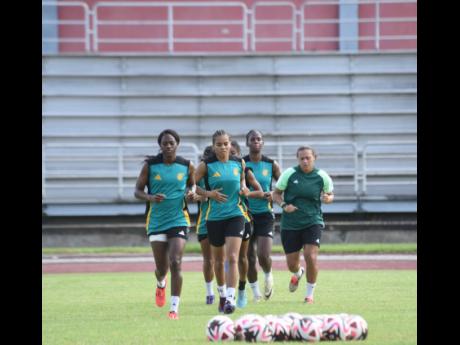 Members of Jamaica’s Reggae Girlz squad warm up ahead of a training session at the Montego Bay Sports Complex on Thursday, November 28, 2024.