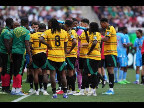 Jamaica’s players take a hydration break during the World Cup playoff final match against DR Congo in Guadalajara, Mexico yesterday.