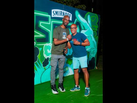 Credit: Contributed KFC’s Andrei Roper (left) and Red Stripe’s Sean Wallace link up at Soca Boot Camp.