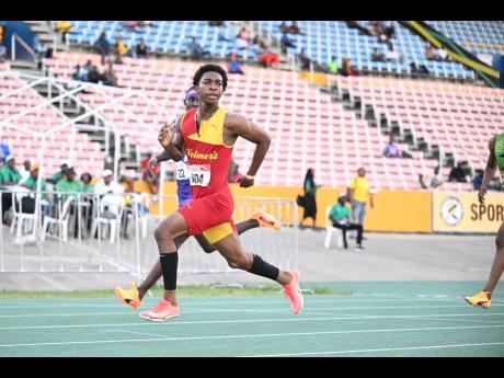 Credit: Gladstone Taylor Mark Daniel Allen, of Wolmer’s Boys, set a record in the Under-17 boys’ 110-metre hurdles.