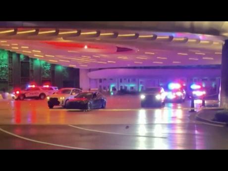 Police and emergency personnel respond to the scene of a shooting at a valet area outside of the Seminole Hard Rock in Hollywood, Fla., on Monday, April 6, 2026. (WSVN via AP)