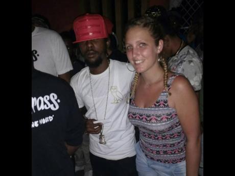 Zoe chills with dancehall star Popcaan in 2016.