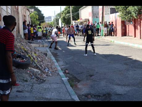 Credit: FILE Residents play football as part of a peace initiative.