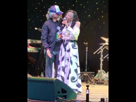 Credit: Contributed Carlene Davis-Cowan and husband Tommy Cowan share a moment on stage.