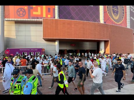 Credit: AP FILE - Fans arrive for the World Cup group B soccer match between England and Iran at the Khalifa International Stadium Doha, Qatar, on Monday, November 21, 2022.