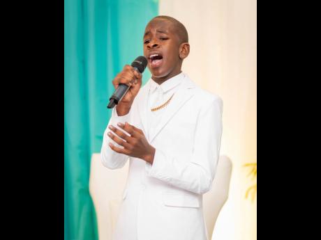 Enoch Thomas performs at his album launch.