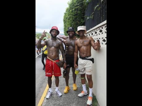 Linking up with the bros while on the road, Nino Adair (left) poses with David Mathie (centre) and Ferhandi Henry.
