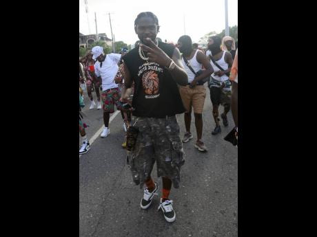 Kemar Highcon enjoying the festivities on the road yesterday.