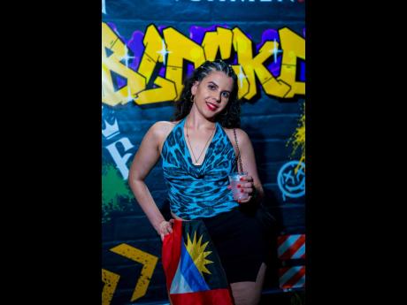 Credit: Contributed Kayla Bahri proudly flew the Antigua and Barbuda flag at Frenchmen Blocko.