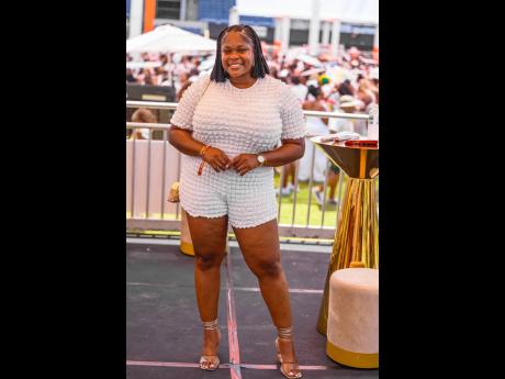 Red Stripe Communications Manager Daika Mitchell is representing for all the corporate girlies, showing off her smile at the sponsored cabana.