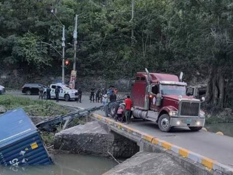 Credit: A trailer truck overturned on Flat Bridge in the Bog Walk Gorge in St Catherine on April 14, 2026.