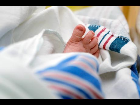 The toes of a newborn baby.