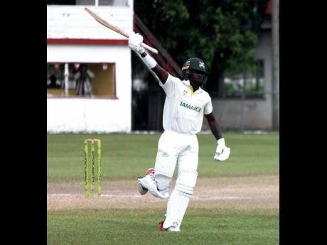 Jamaica Scorpions’ Kirk McKenzie Jr. celebrates scoring a century on the fourth day of the West Indies Championship cricket match against Barbados Pride at Chedwin Park, St Catherine on Wednesday.