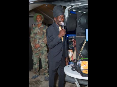 Sizzla addresses the audience at the event. 