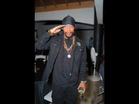 Reggae star Turbulence salutes the camera as he waits for the proceedings to begin.