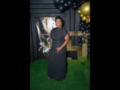 Anika Collins, Sizzla’s wife, showed out in black matching the gold and black theme of the celebration.