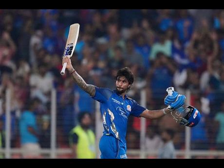 Mumbai Indians’ Tilak Verma celebrates his century during the Indian Premier League cricket match against Gujarat Titans in Ahmedabad, India, on Monday.