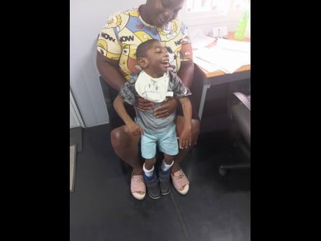 Jackson-Parkinson holds her son RJ.