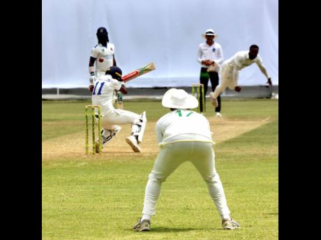 Barbados Pride captain Kraigg Brathwaite (second left) evades a sharp bouncer from Jamaica Scorpions fast bowler Ojay Shields on day two of their West Indies Championship cricket match at Sabina Park.