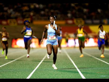 Edwin Allen High School’s Renecia Edwards anchors her team to win the Class One girls’ 4x100m relay on day five of the ISSA GraceKennedy Boys’ and Girl’s Athletics Championships on March 28 at the National Stadium. 