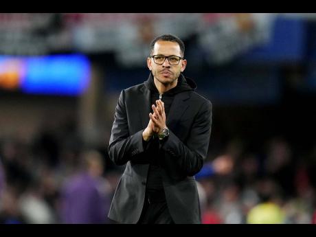 Chelsea’s head coach Liam Rosenior leaves the field after the English Premier League soccer match against Manchester United in London, on Saturday.